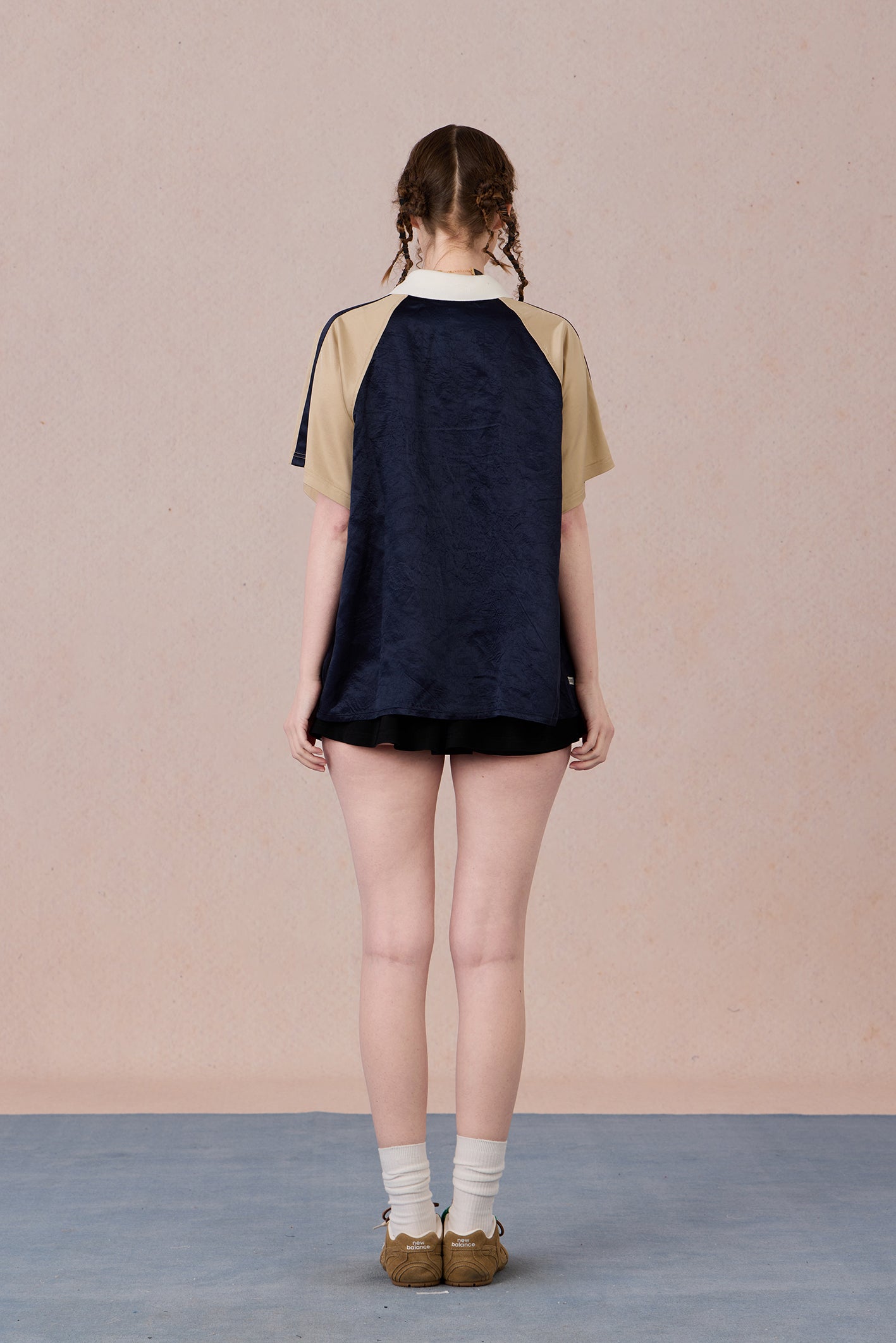 Soft draping silhouette with modern Chinese-inspired neckline
