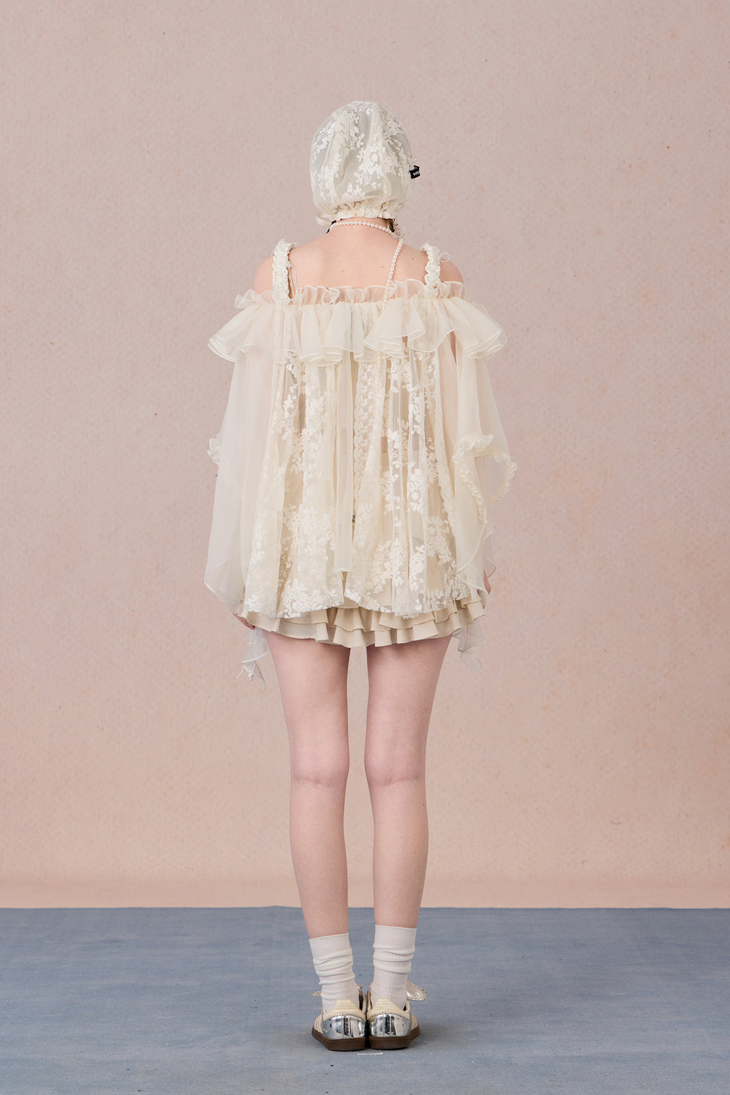 Strapless romantic blouse with asymmetrical lace overlay