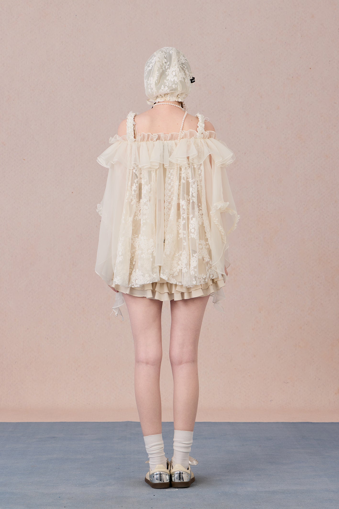 Strapless romantic blouse with asymmetrical lace overlay