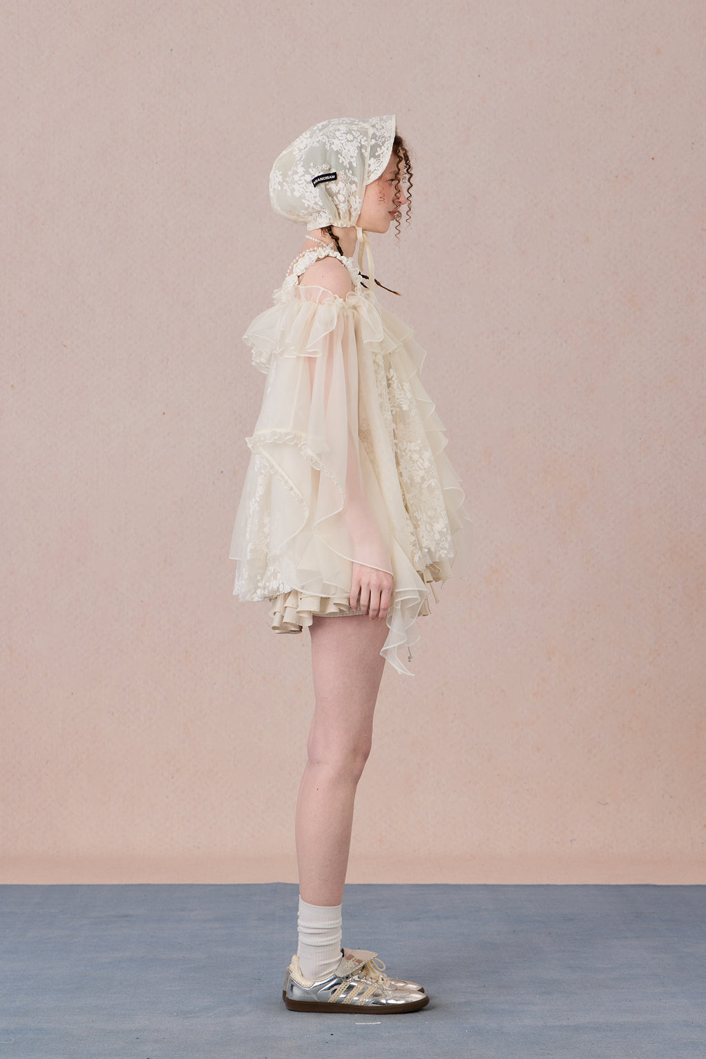 Strapless romantic blouse with asymmetrical lace overlay