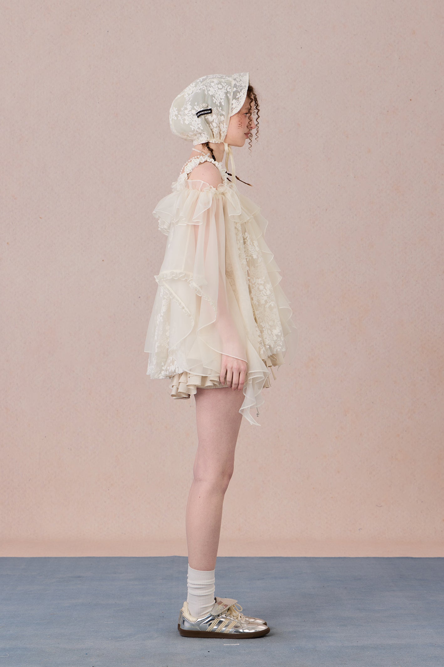 Strapless romantic blouse with asymmetrical lace overlay