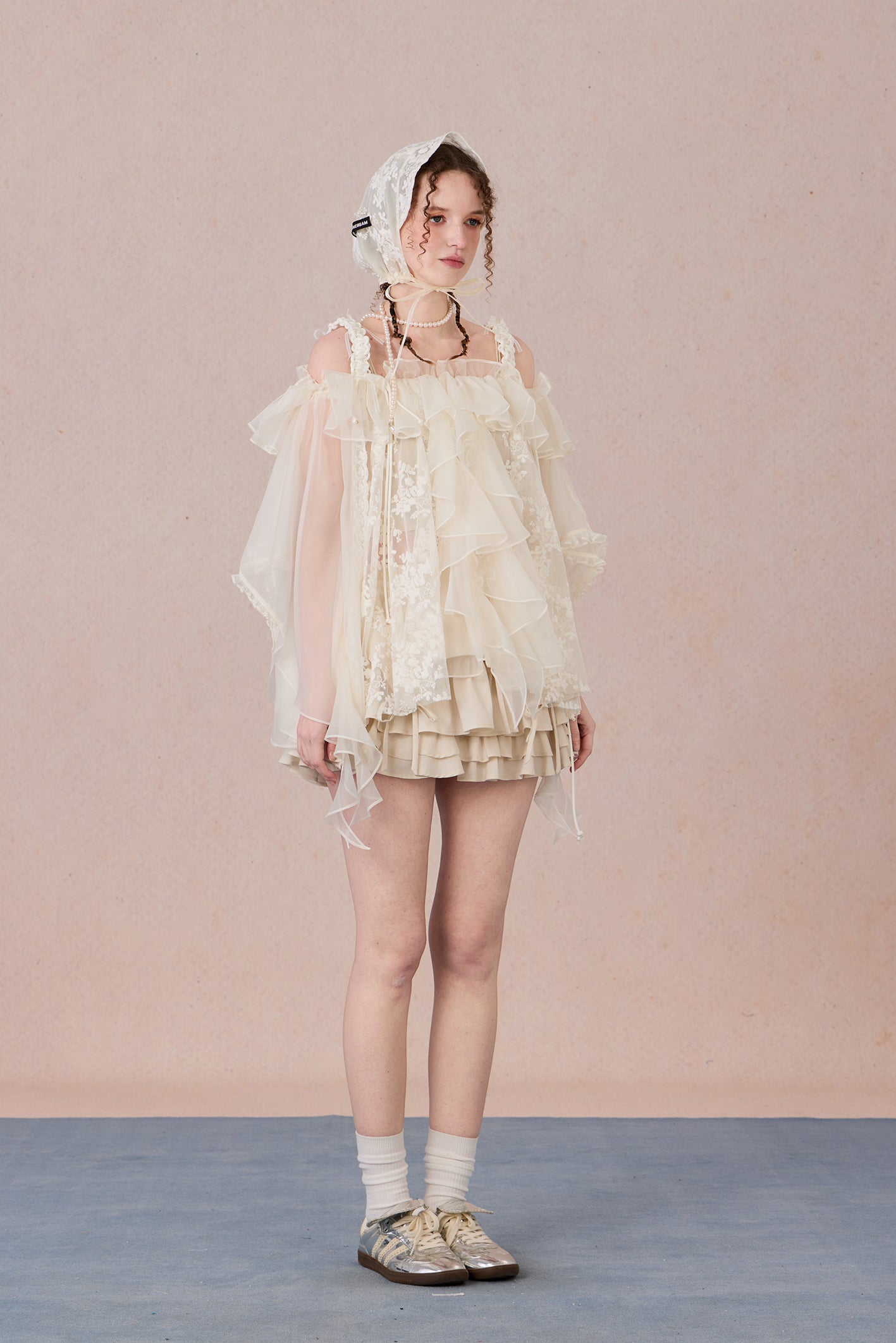 Strapless romantic blouse with asymmetrical lace overlay