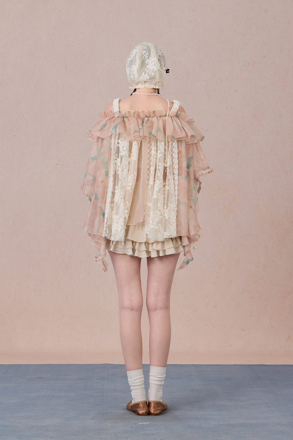 Strapless romantic blouse with asymmetrical lace overlay