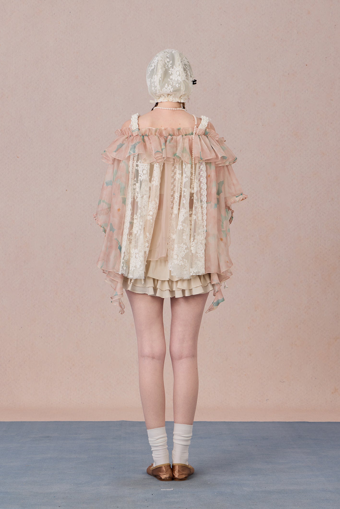 Strapless romantic blouse with asymmetrical lace overlay