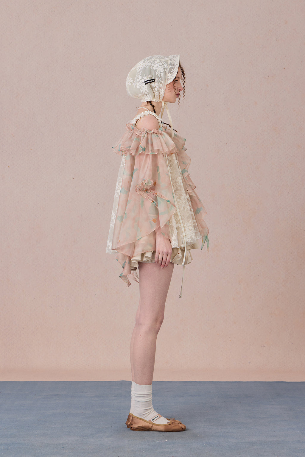 Strapless romantic blouse with asymmetrical lace overlay