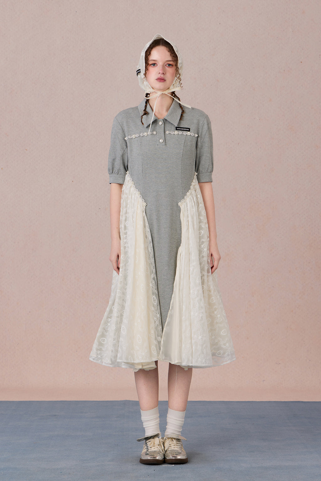 	Model wearing lace-trimmed polo midi dress with pearl accents – WEANCHEAM