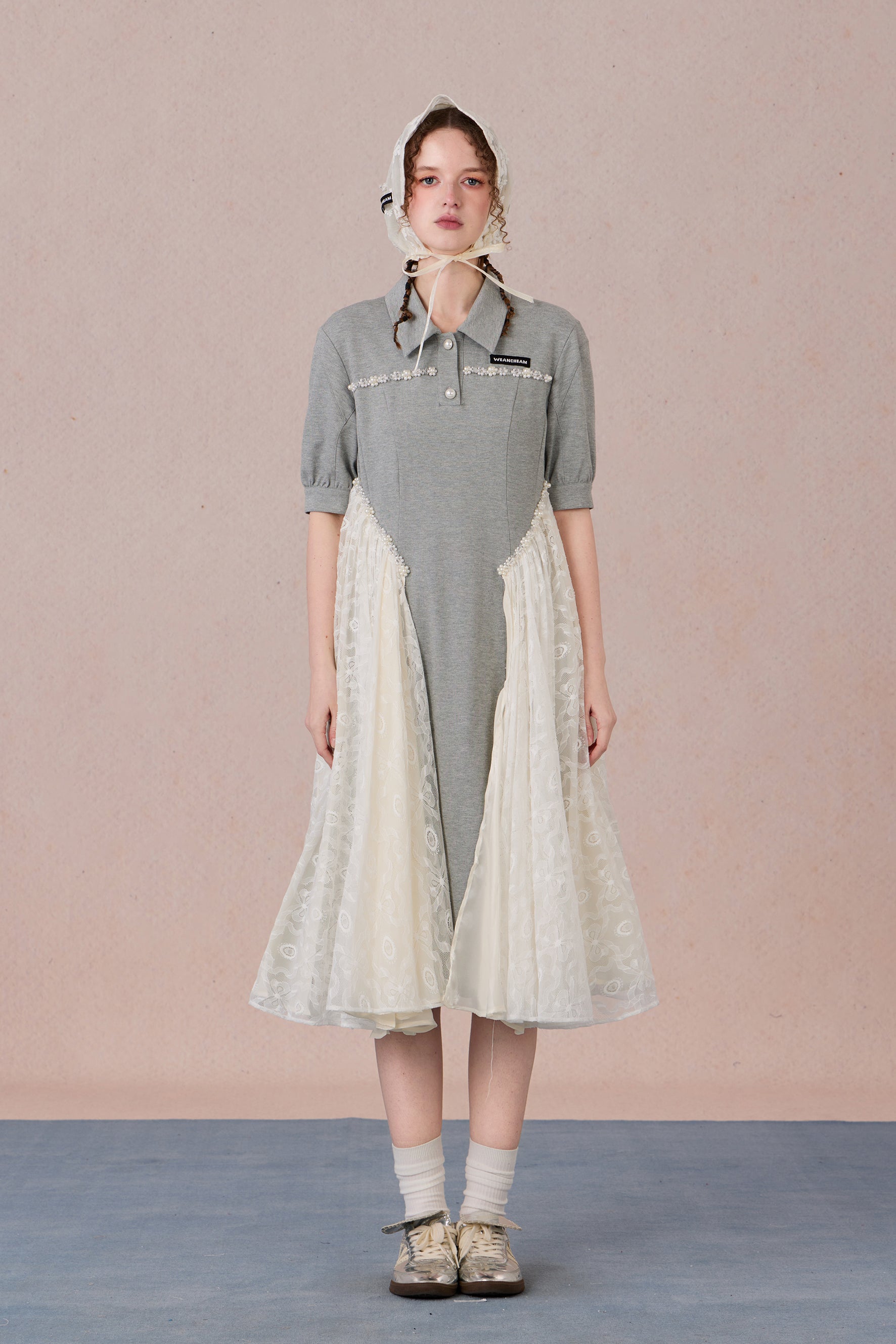 	Model wearing lace-trimmed polo midi dress with pearl accents – WEANCHEAM
