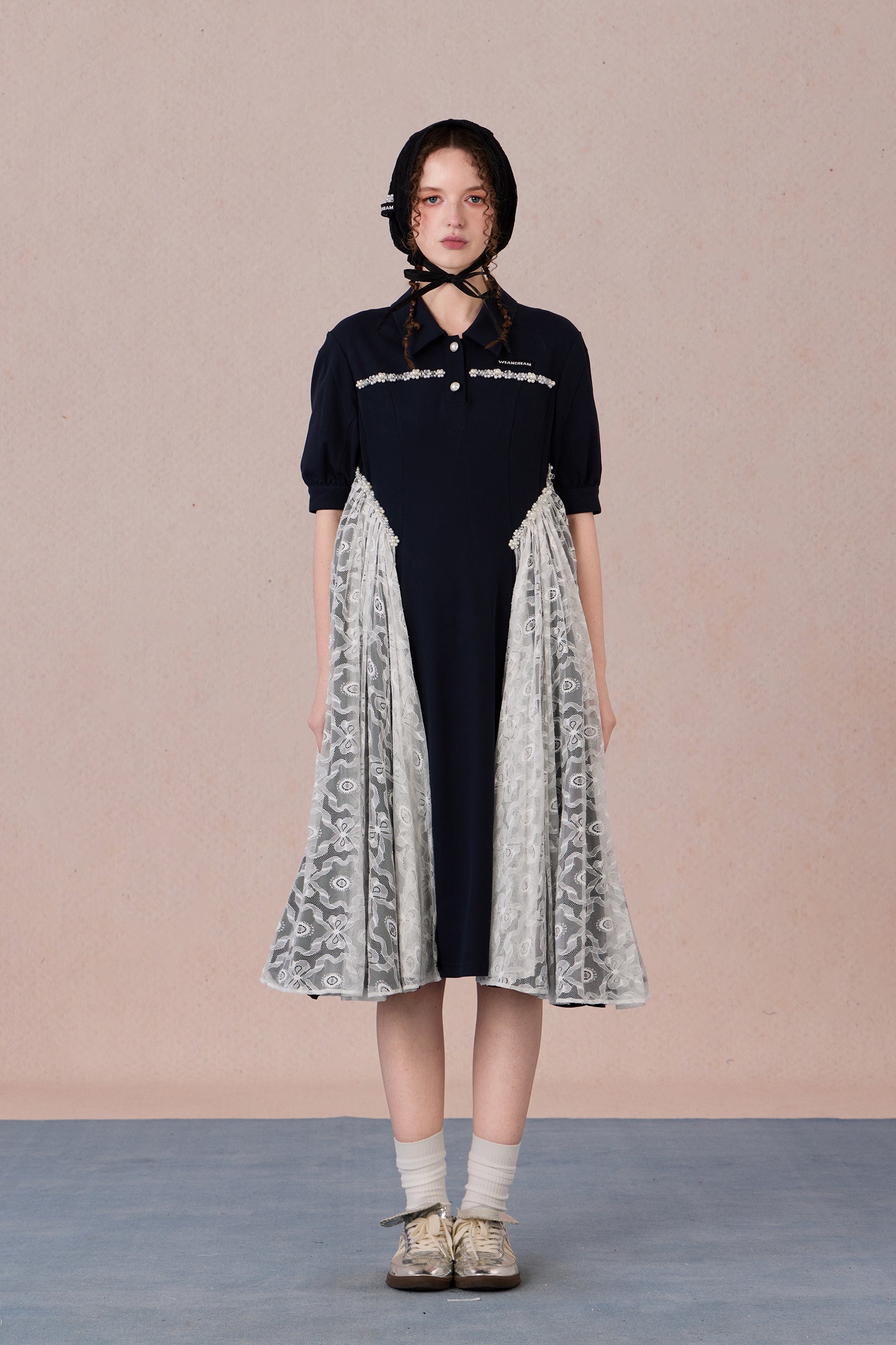 	Model wearing lace-trimmed polo midi dress with pearl accents – WEANCHEAM