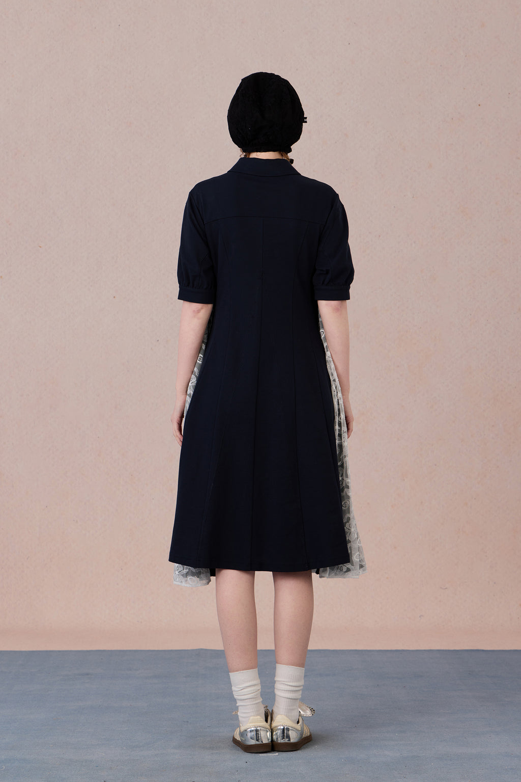 	Model wearing lace-trimmed polo midi dress with pearl accents – WEANCHEAM
