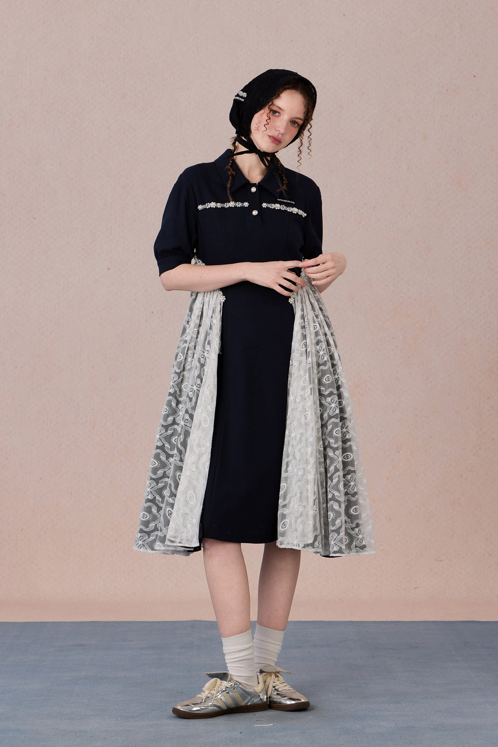 	Model wearing lace-trimmed polo midi dress with pearl accents – WEANCHEAM
