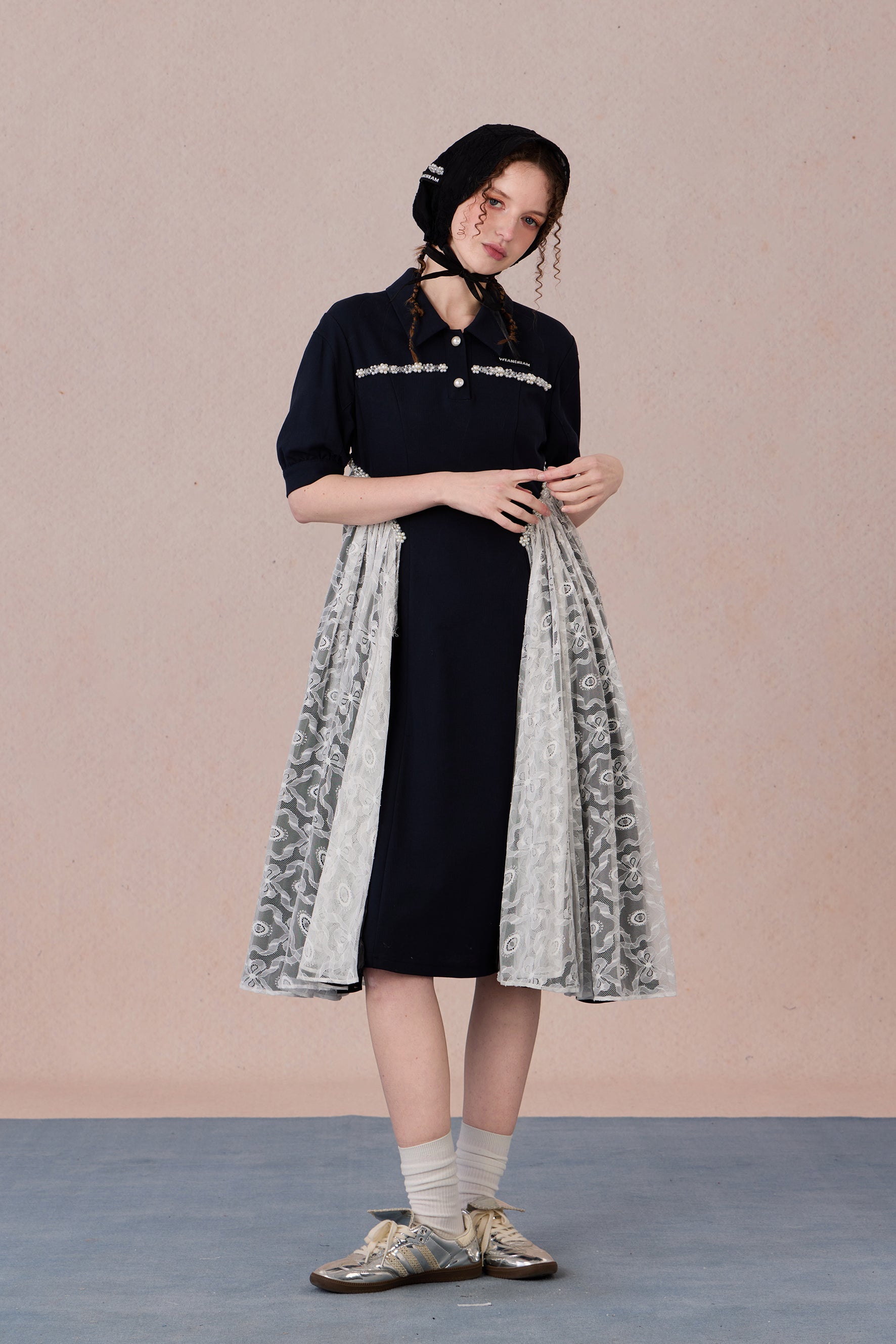 	Model wearing lace-trimmed polo midi dress with pearl accents – WEANCHEAM