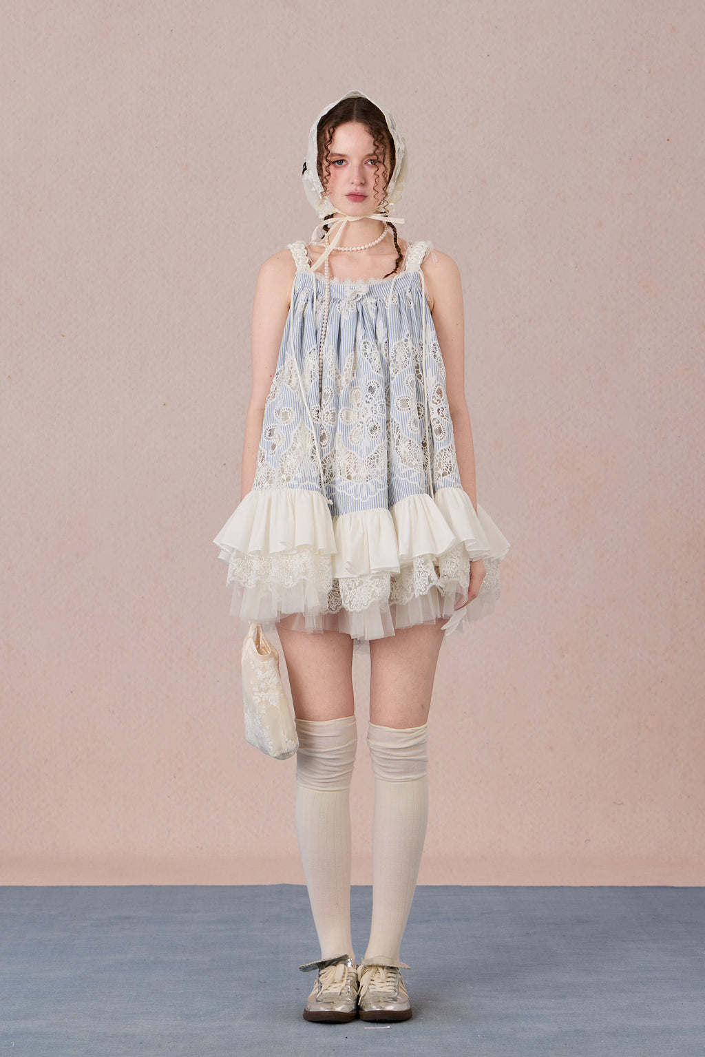 Model wearing romantic striped halter dress with tiered hem – WEANCHEAM