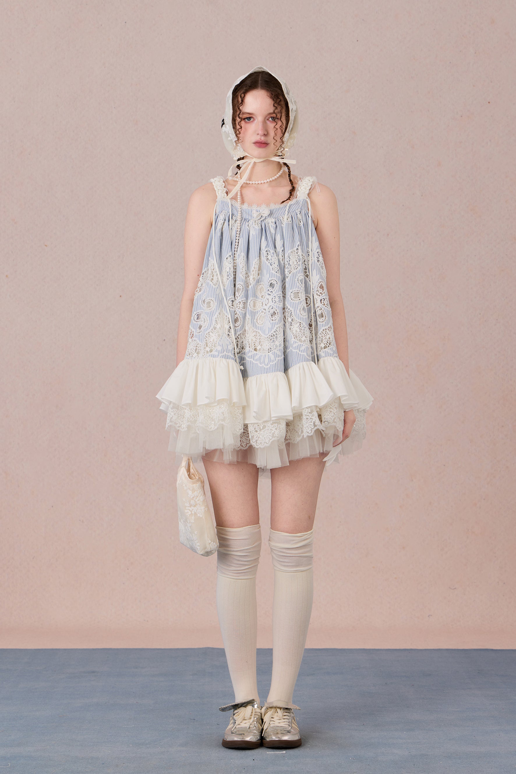 Model wearing romantic striped halter dress with tiered hem – WEANCHEAM