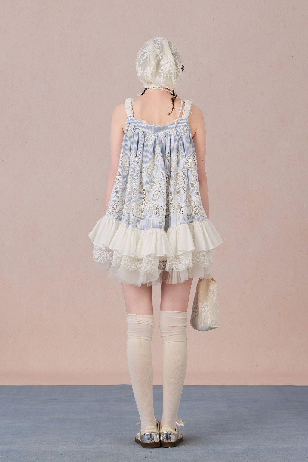 Model wearing romantic striped halter dress with tiered hem – WEANCHEAM