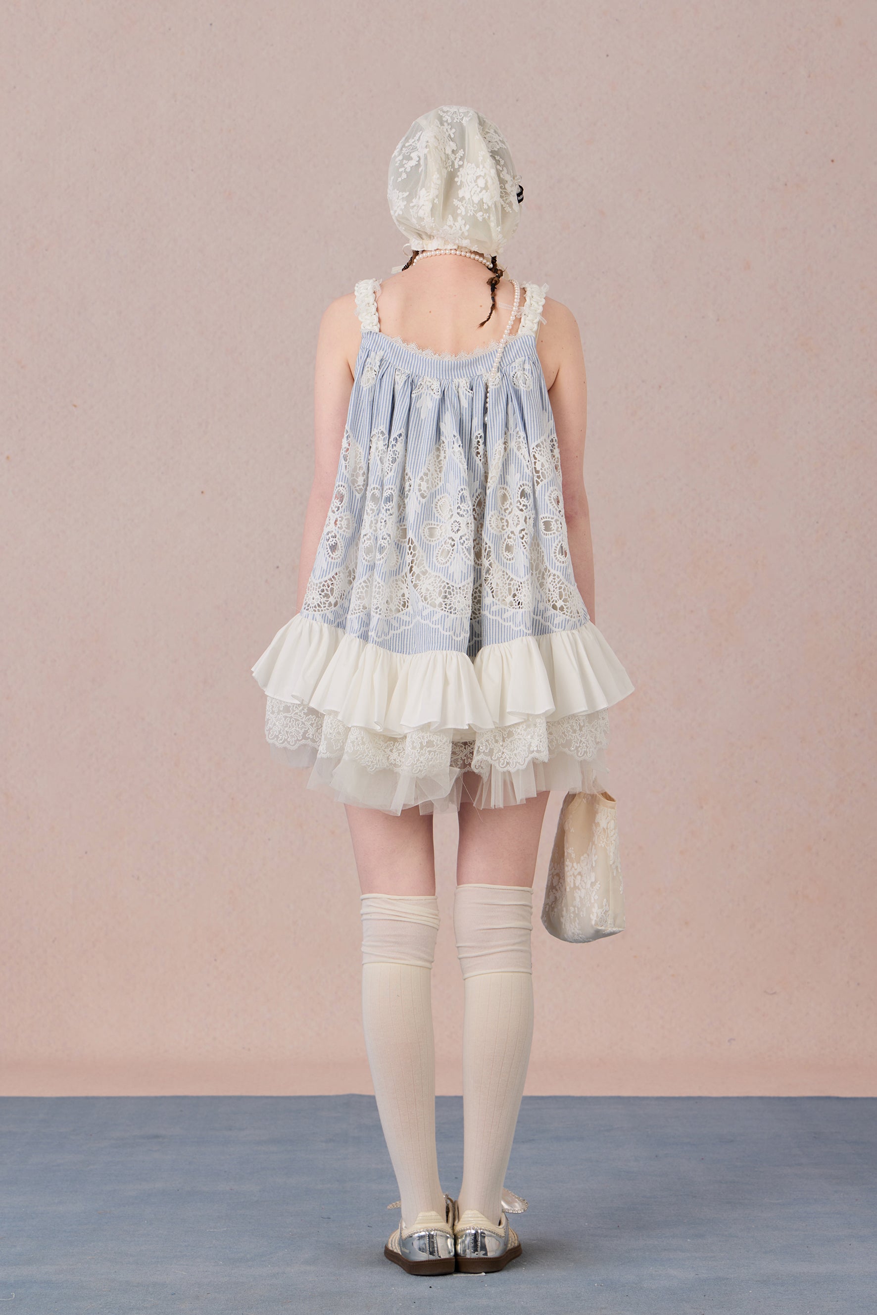 Model wearing romantic striped halter dress with tiered hem – WEANCHEAM