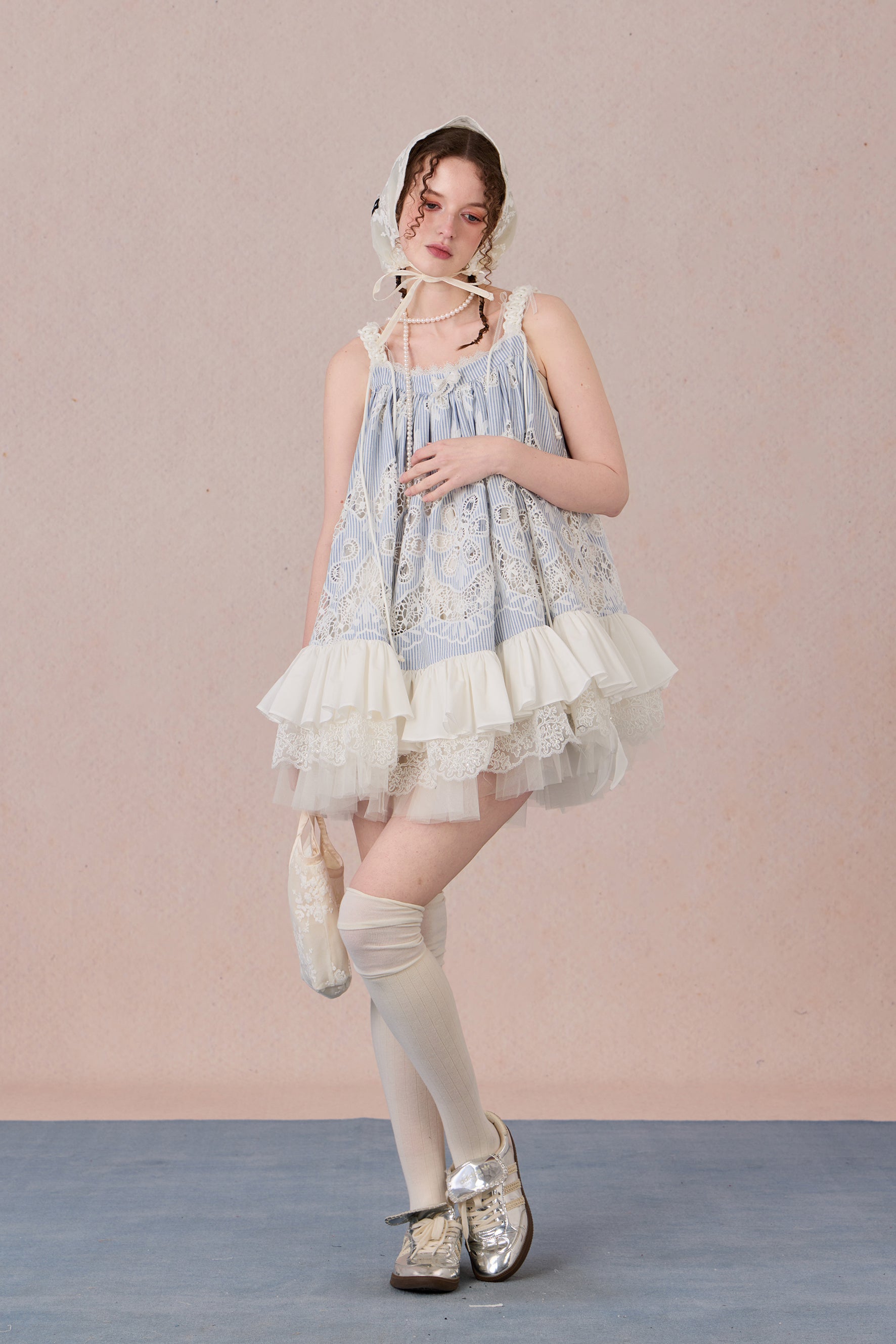 Model wearing romantic striped halter dress with tiered hem – WEANCHEAM