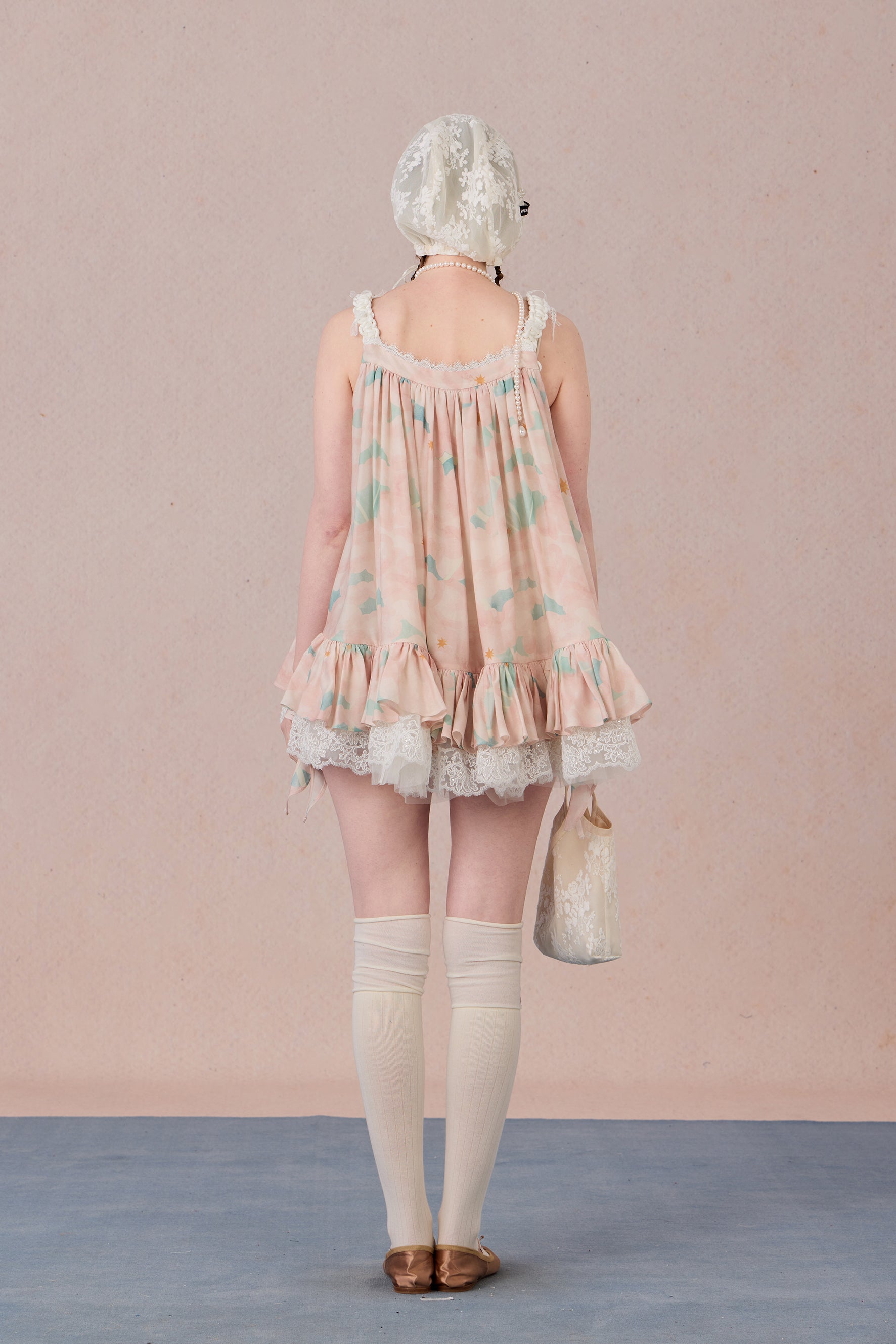Model wearing romantic striped halter dress with tiered hem – WEANCHEAM