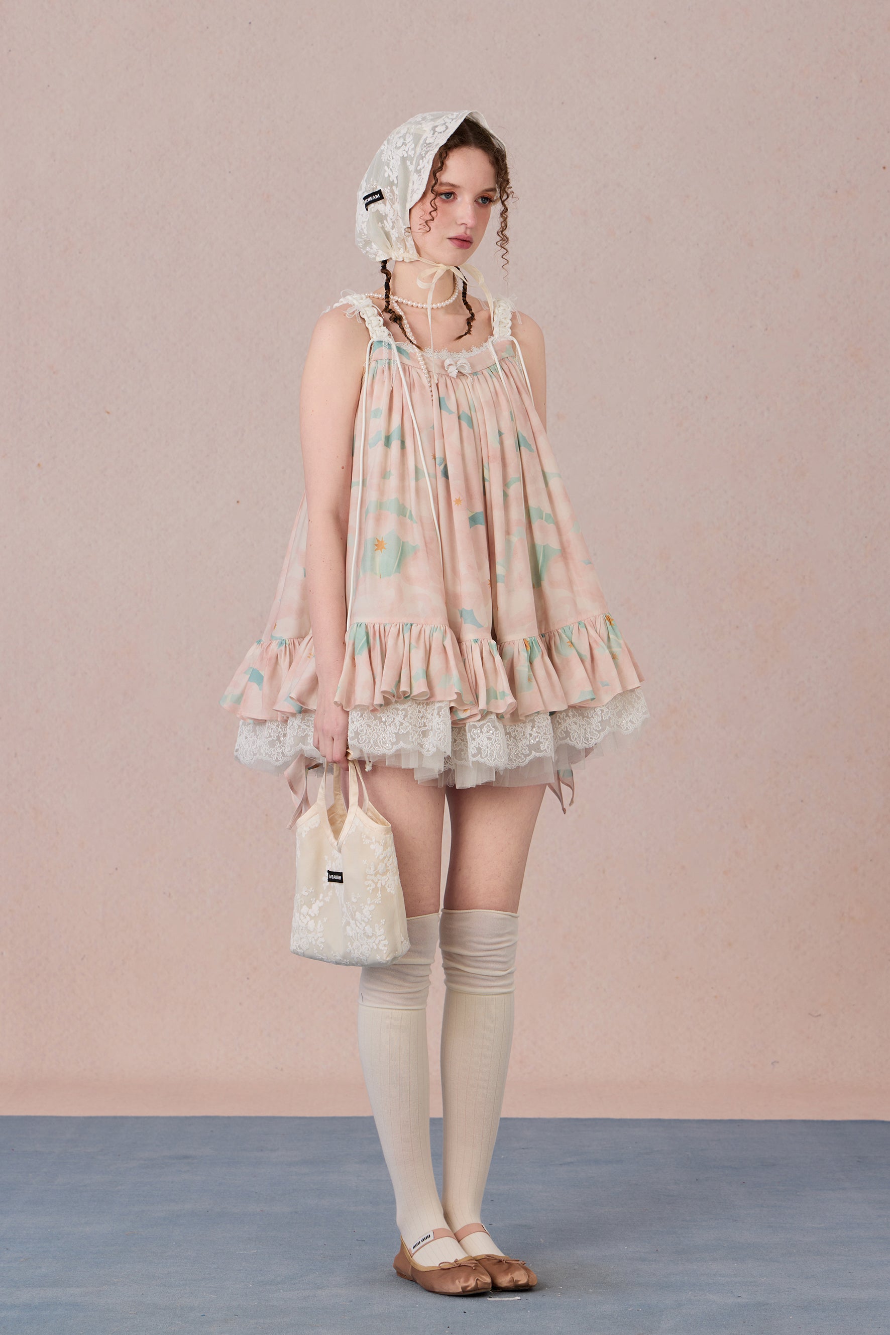 Model wearing romantic striped halter dress with tiered hem – WEANCHEAM